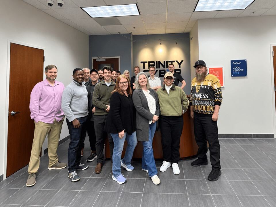 The Trinity Cyber team gathered in the office lobby